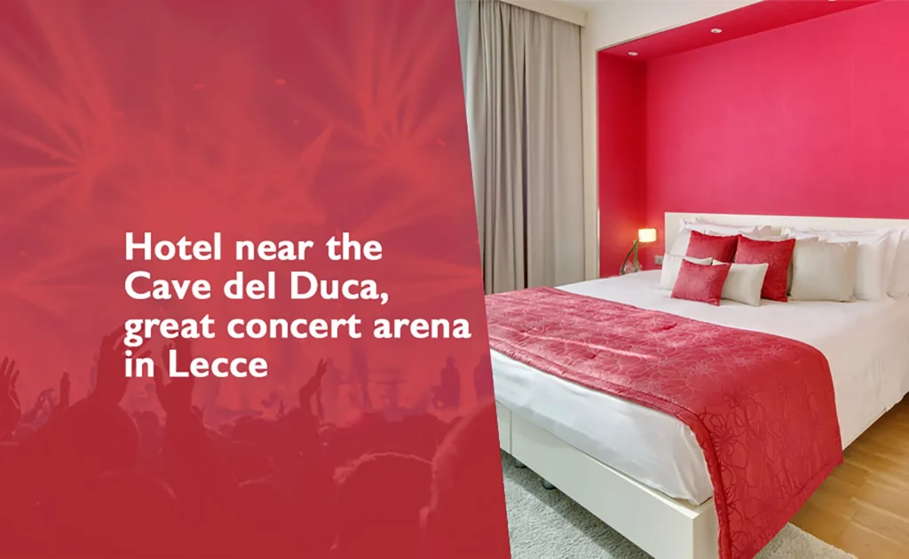 Promotional image featuring a hotel room with white walls and a red accent wall. The double bed is covered in white linens and a red bedspread, complemented by red and white pillows. The hotel logo is superimposed. On the left side of the image, against a red background with silhouettes of an audience and concert lights, is the text: "Hotel near the Cave del Duca, concert arena in Lecce." The room is bright, with light-colored curtains and a light-colored wood floor.